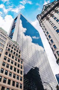 Low angle view of modern buildings against sky