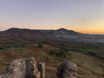 Scenic view of landscape against sky during sunset