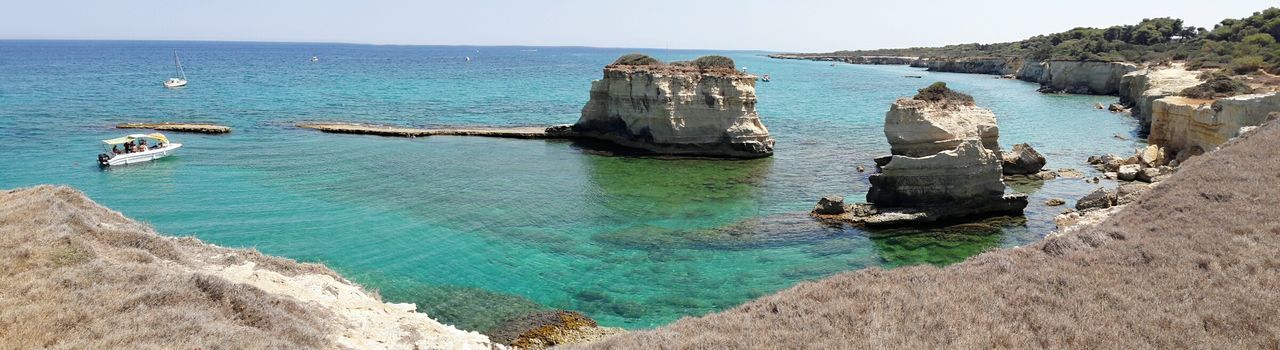 PANORAMIC SHOT OF SEA AGAINST CLEAR SKY