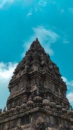 Low angle view of historical building against blue sky