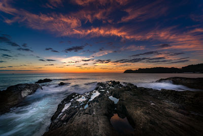 Scenic view of sea against sky at sunset