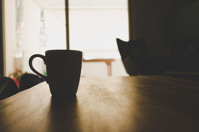 Close-up of coffee cup on table