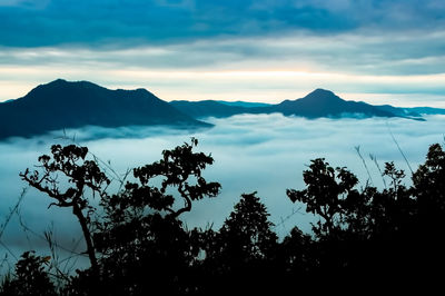Scenic view of silhouette mountains against sky during sunset
