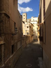 Narrow alley amidst buildings in town