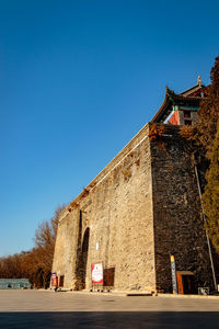 Low angle view of church against blue sky