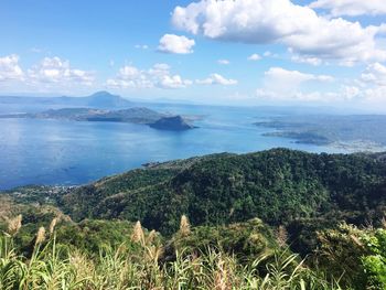 Scenic view of calm sea against cloudy sky