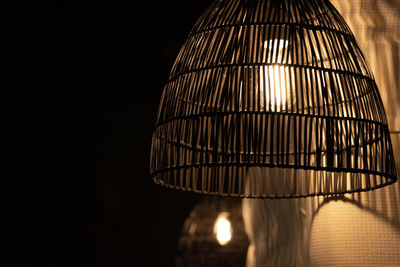 Close-up of illuminated lights against black background