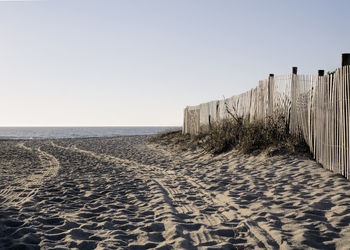 Scenic view of beach against clear sky