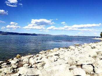 Scenic view of sea against blue sky