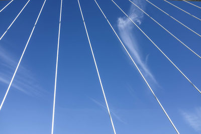 Low angle view of vapor trails