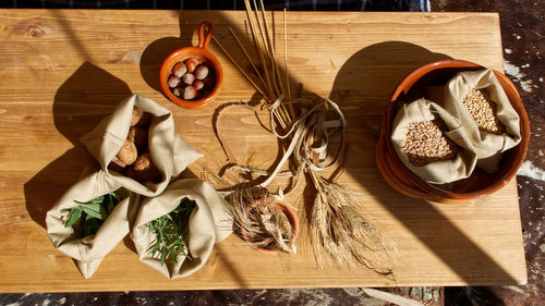 Wheat seeds, hazelnuts, walnuts on wooden table. healthy and nutrition food concept