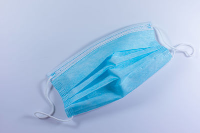 High angle view of blue umbrella against white background