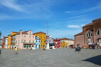 View of buildings against blue sky