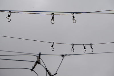 Low angle view of electricity pylon against sky