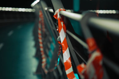 Close-up of cordon tape on railing