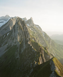 Scenic mountain view in switzerland while hiking during sunset. shot on kodak portra 400 film.