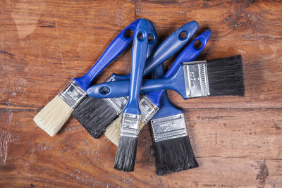 High angle view of various objects on hardwood floor