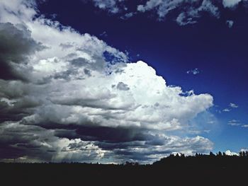 Scenic view of landscape against cloudy sky