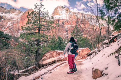 Full length of man walking against mountain