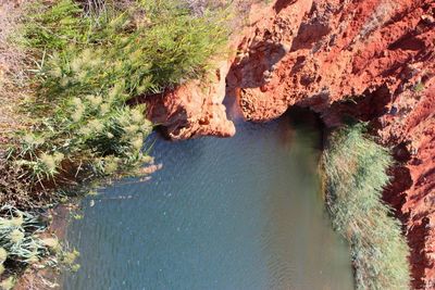 High angle view of rocks by sea