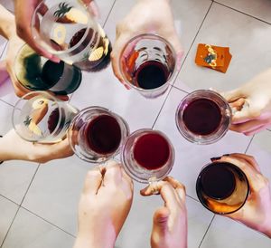 High angle view of woman hand holding glass