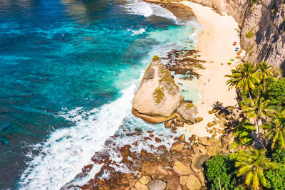 High angle view of rocks in sea