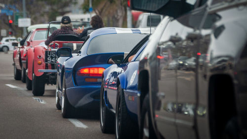 Classic cars driving down the street