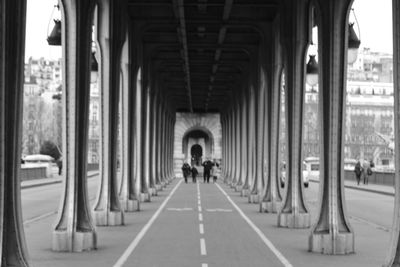 People walking on colonnade