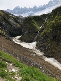 Scenic view of landscape and mountains against sky