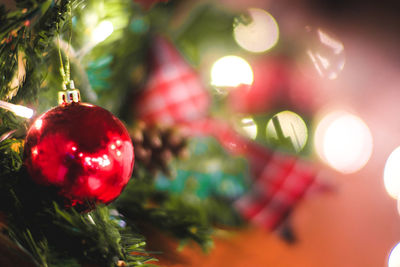 Close-up of christmas decorations hanging on tree