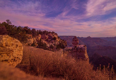 Rock formations on landscape against sky