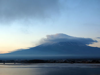 Scenic view of mount fuji against cloudy sky