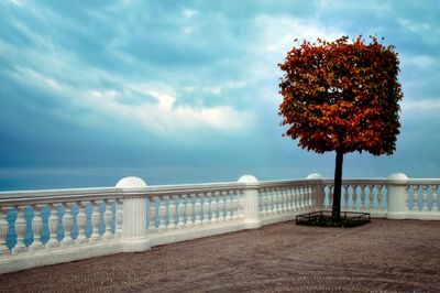 Built structure by sea against sky