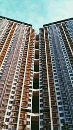 Low angle view of modern buildings against sky in city