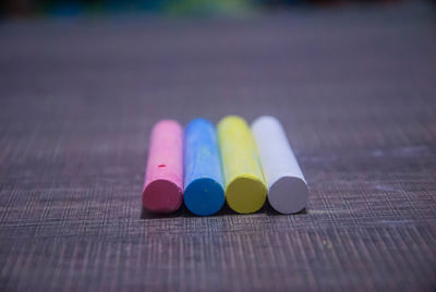 Close-up of multi colored pencils on table