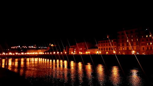 Reflection of illuminated sky on water at night