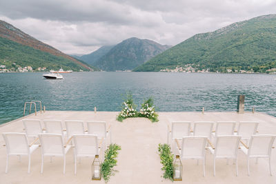 Scenic view of sea and mountains against sky