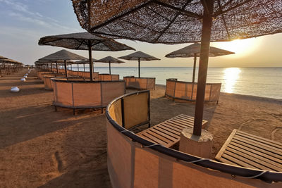 Built structures on beach against sky