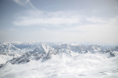 Scenic view of snowcapped mountains against sky