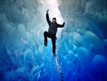 Woman jumping in water