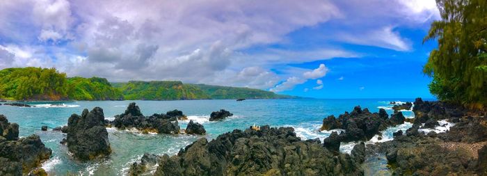 Panoramic view of sea against blue sky
