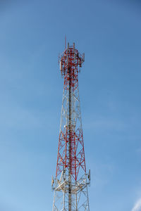 Low angle view of communications tower against sky