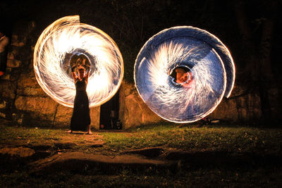 Close-up of illuminated lighting equipment at night