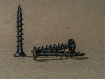 Close-up of screws on table