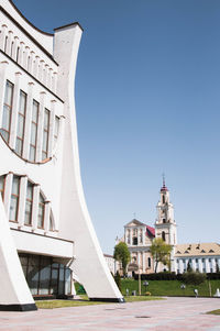 Low angle view of building against clear blue sky