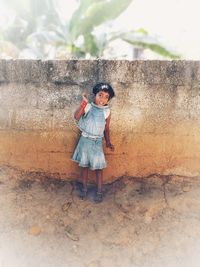 Full length of cute girl standing outdoors