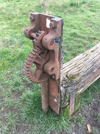 Close-up of rusty metal on grass