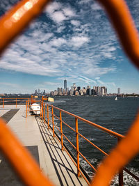 Panoramic view of sea and buildings against sky