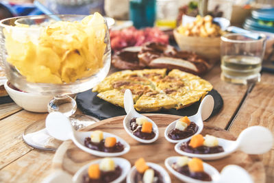 Close up view of foods on a wooden table viande multicolor ready for party apetizing colorful buffet