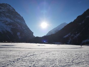 Scenic view of snowcapped mountains against sky